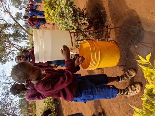 24 - Programs - 2021 goals - Students washing hands 02 (2).jpg