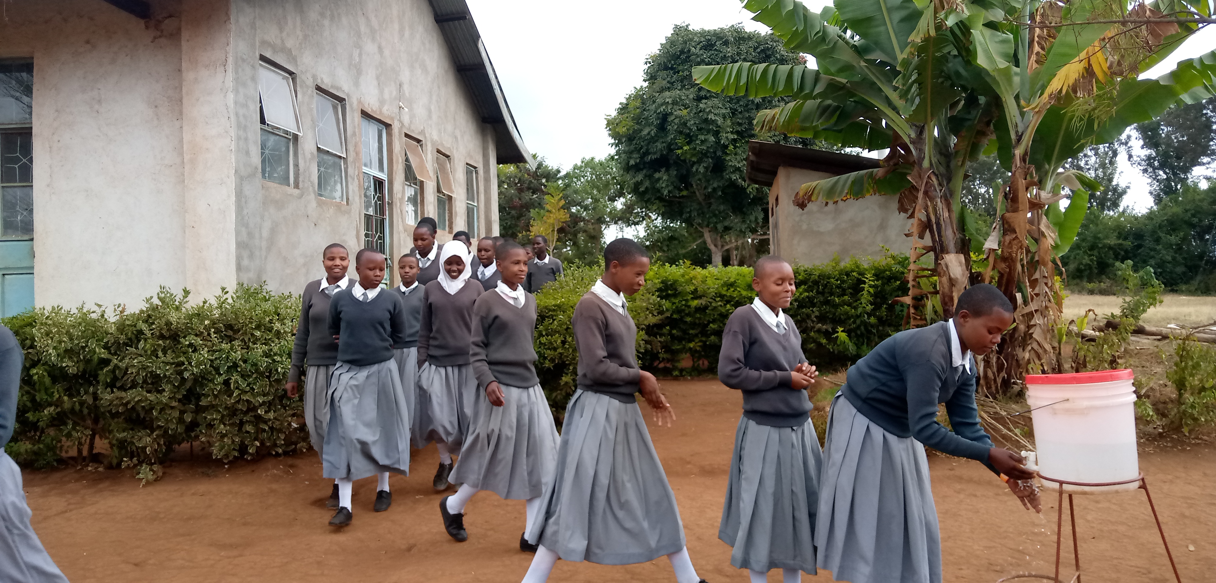 6.31 - Project 2021 - Tsaayho Secondary bathrooms - Students washing hands after bathroom use 01.jpg