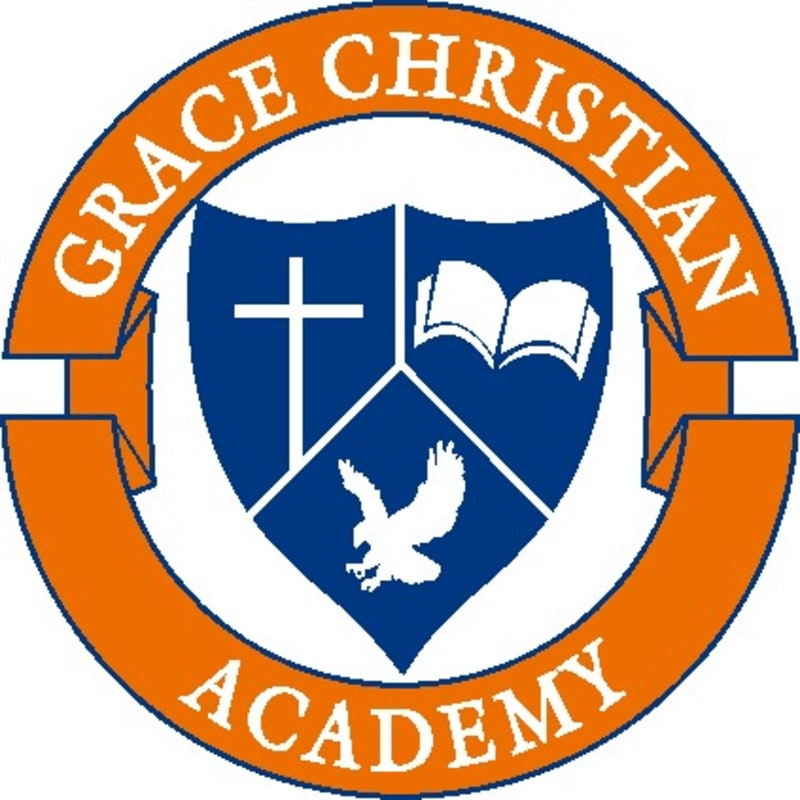 An orange circular emblem with the words "GRACE CHRISTIAN ACADEMY" frames a blue shield divided into three sections, featuring a white cross, an open book, and a soaring eagle.