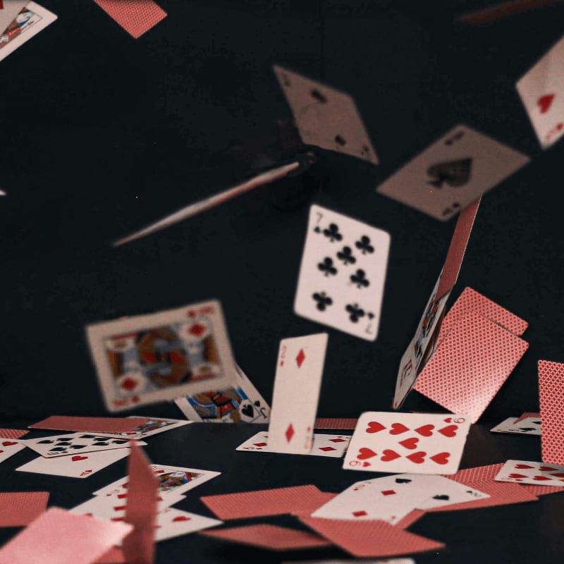 a table topped with lots of playing cards