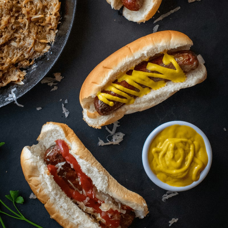 a couple of hot dogs sitting on top of a table