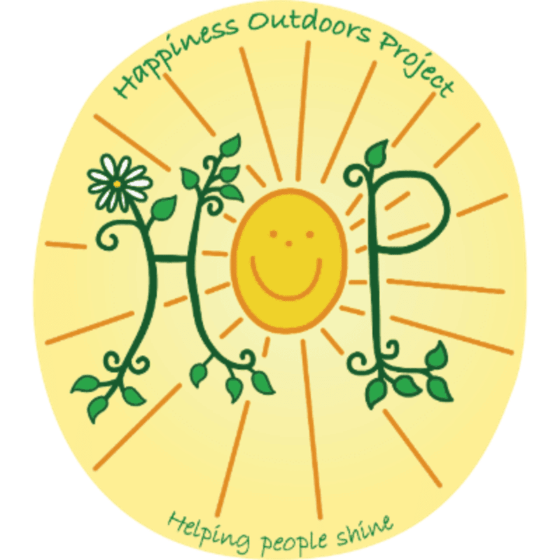 A yellow sun with a smiley face is in the center, with green vines forming the letters "HOP" and a daisy on the left, all set against a bright yellow background with radiating lines.