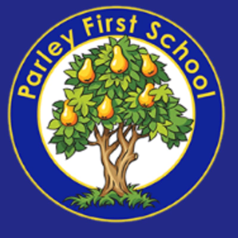 A cartoon tree laden with pears stands in the foreground, set against a circular background with the words "Parley First School" in a blue and yellow ring.