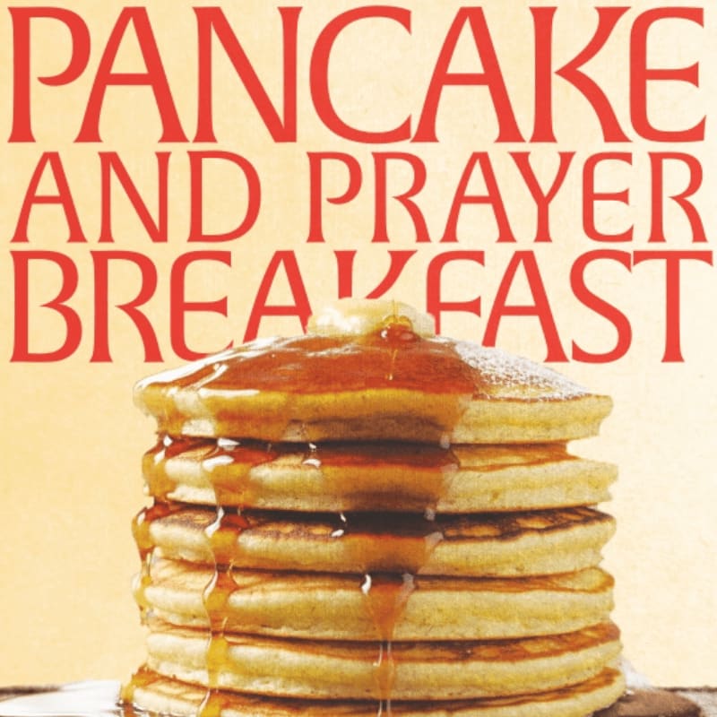 A stack of syrup-drenched pancakes with butter sits in the foreground, beneath bold red text that reads "PANCAKE AND PRAYER BREAKFAST" against a soft yellow background.