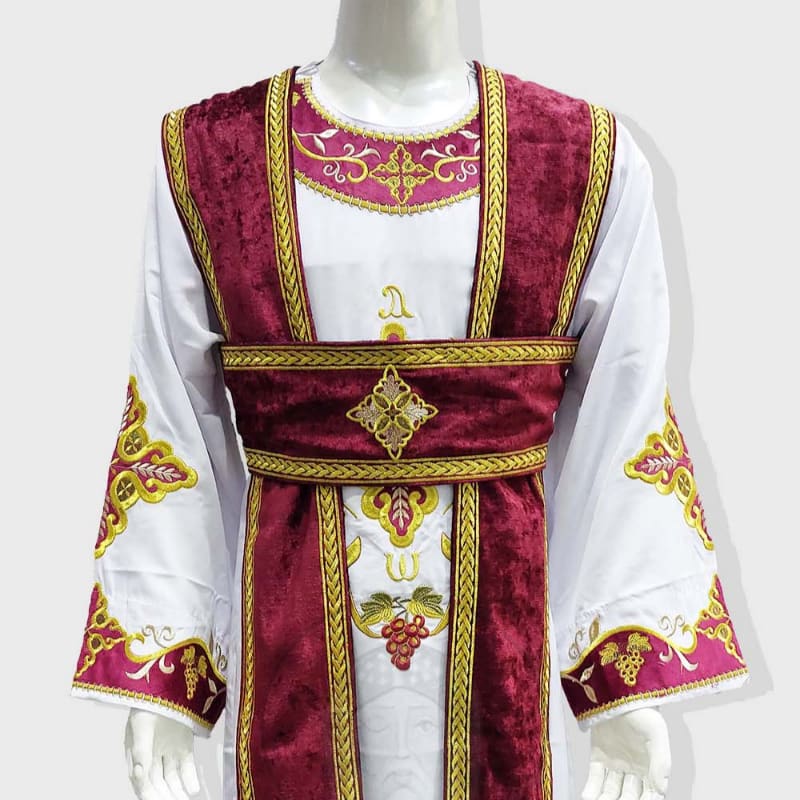 A white robe with ornate burgundy and gold trim is displayed against a plain white background.