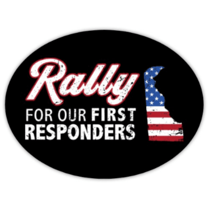 A black oval sticker features the word "Rally" in white script with red outline, followed by "FOR OUR FIRST RESPONDERS" in white block letters, all set against a backdrop of the state of Delaware filled with the American flag.