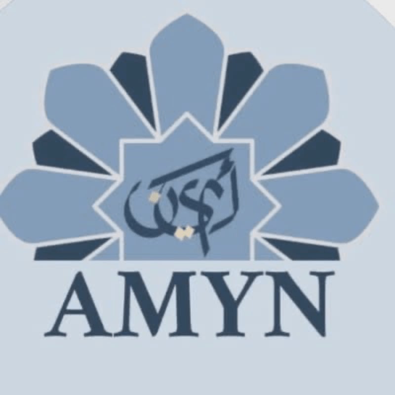 A blue Islamic geometric design with Arabic calligraphy in the center is superimposed on a light blue background, with the word "AMYN" in dark blue text below.