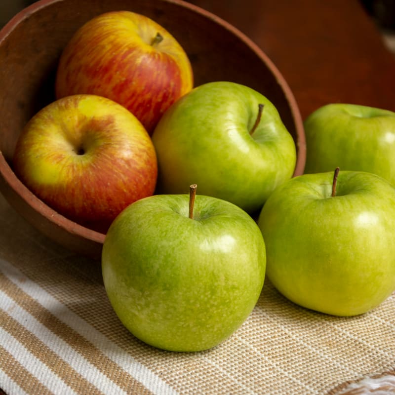 green apple on white table cloth