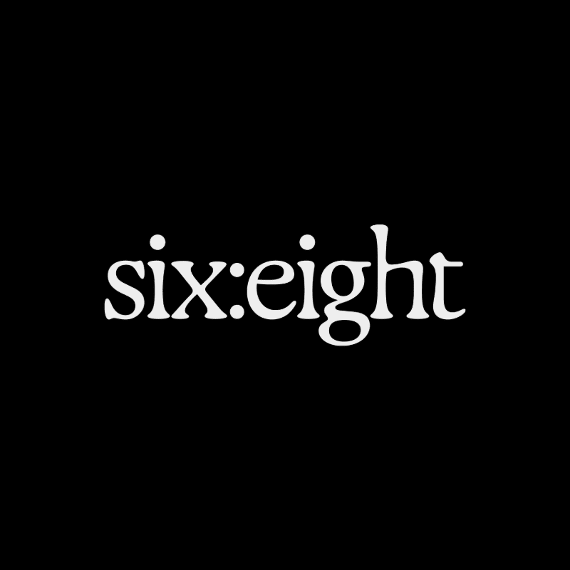 White text reading "six:eight" is centered on a black background.