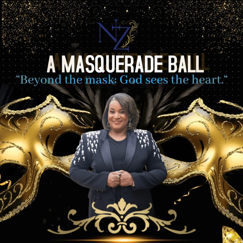 A woman in a blazer stands in front of a gold masquerade mask and a black background with gold glitter.