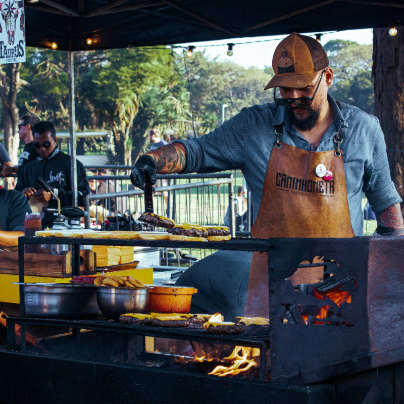 man grilling patties