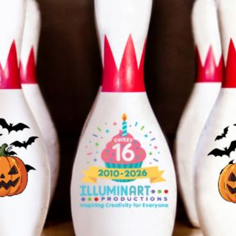Several bowling pins, decorated with Halloween imagery and a "Sweet 16" graphic, stand in front of a dark, blurred background.