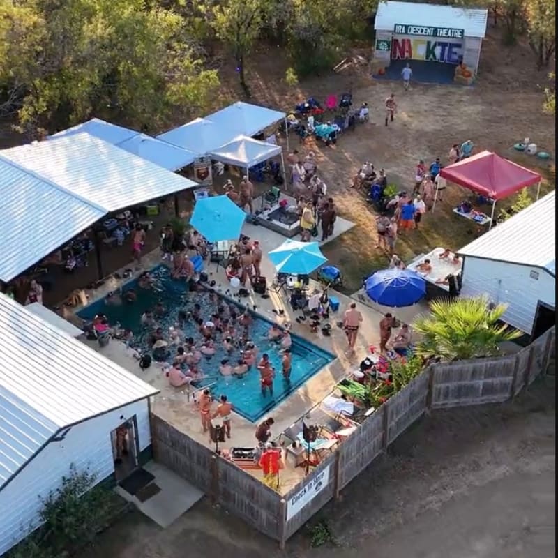 A crowded pool party with people swimming and lounging is set against a backdrop of trees and a stage with the words "NAKTE" visible.
