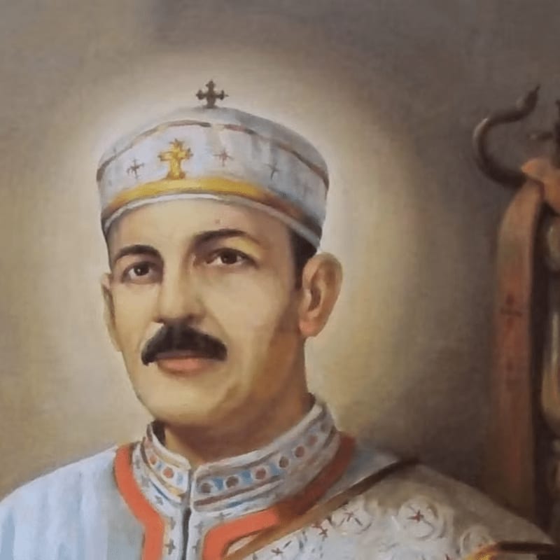 A man in religious attire with a halo is painted against a muted, ornate background.