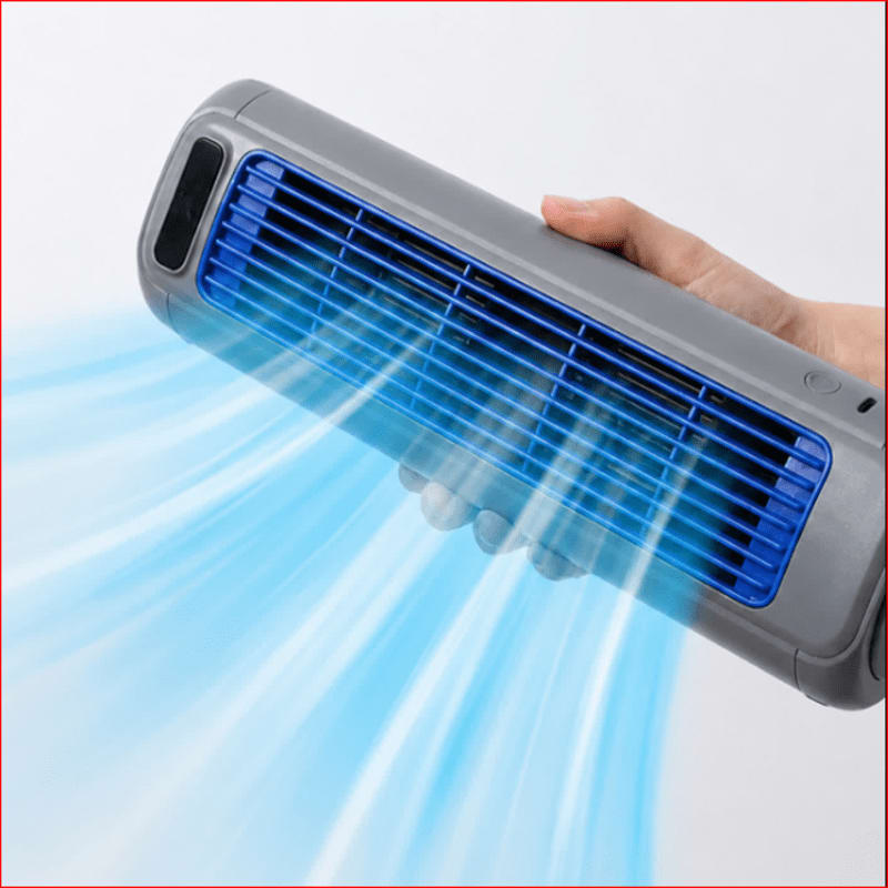 A hand holds a gray and blue portable fan emitting a cool blue breeze against a plain white background.