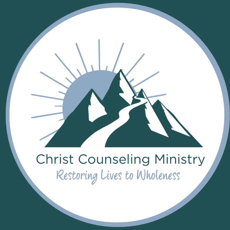 A winding path ascends dark, snow-capped mountains under a rising sun, with the text "Christ Counseling Ministry Restoring Lives to Wholeness" below.