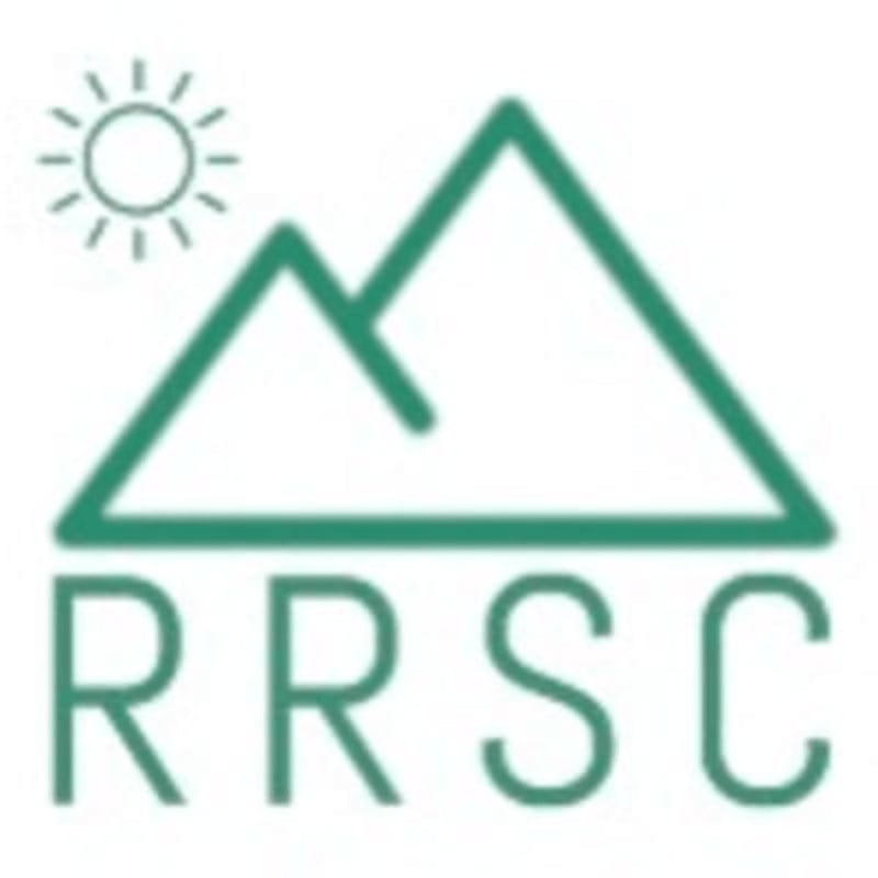 A stylized sun shines above green mountains, with the letters "RRSC" in green below.