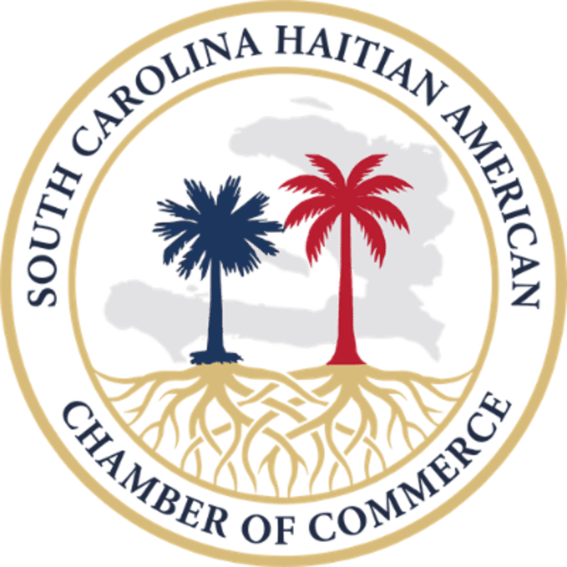 Two palm trees, one blue and one red, stand with exposed roots in the foreground, set against a faint outline of Haiti in the background, all within a circular emblem that reads "SOUTH CAROLINA HAITIAN AMERICAN CHAMBER OF COMMERCE."