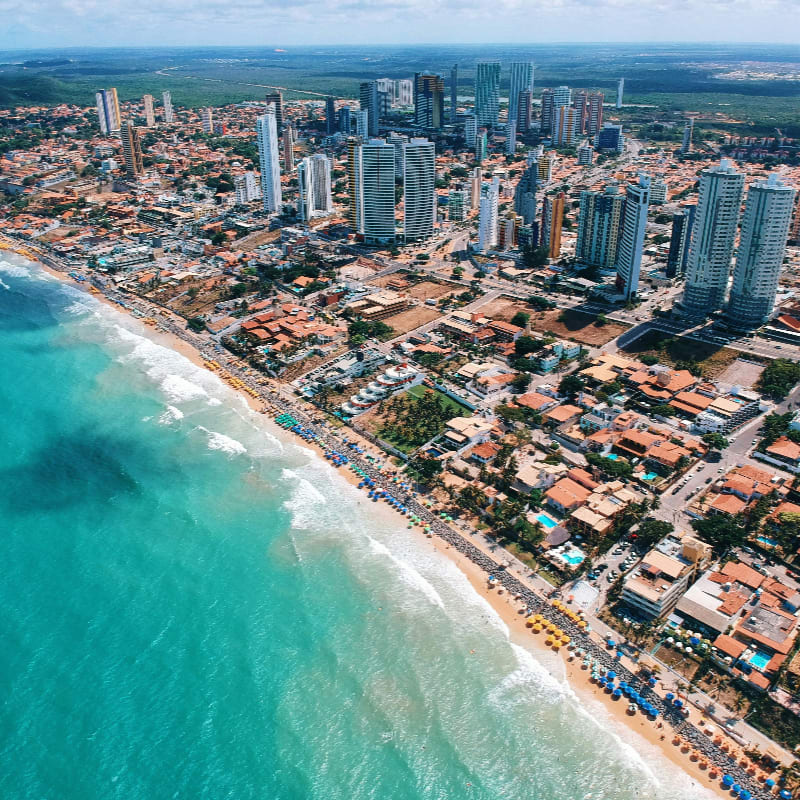 aerial photography of city building near the seashore during daytime