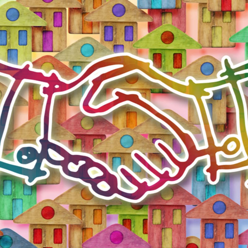 A colorful handshake graphic overlays a background of many small, stylized houses.