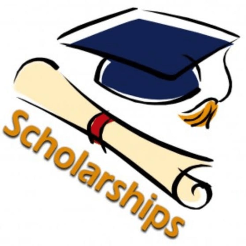 A graduation cap and diploma with the word "Scholarships" are in the foreground, set against a plain white background.