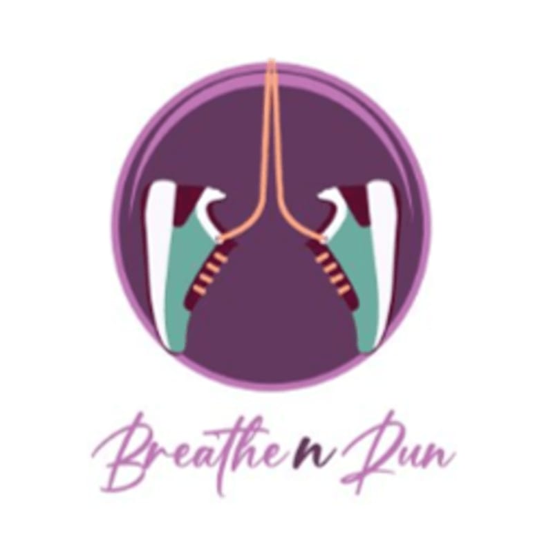 A pair of teal and maroon sneakers with orange laces are suspended within a purple circle, with the words "Breathe n Run" written below in a cursive font.
