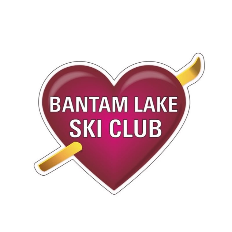 A glossy, heart-shaped sticker with "BANTAM LAKE SKI CLUB" written in white text is pierced by a golden arrow against a white background.