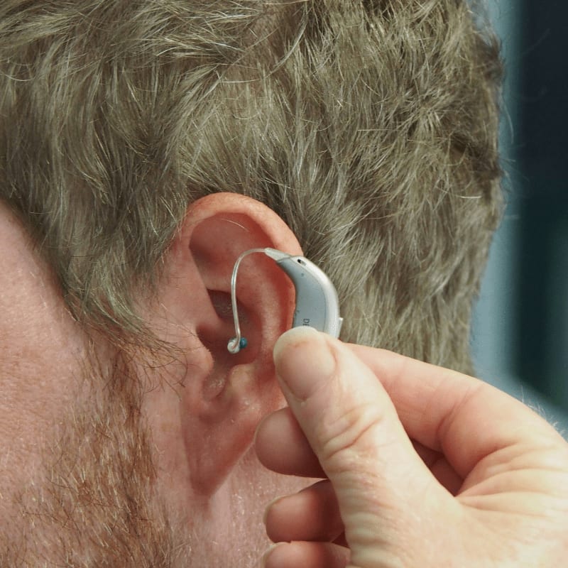 a man wearing a pair of ear piercings