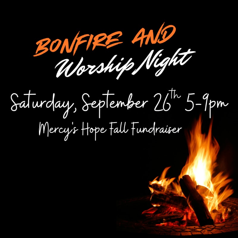 A vibrant bonfire burns in the foreground against a dark background with text announcing "Bonfire and Worship Night" on Saturday, September 26th from 5-9pm, a Mercy's Hope Fall Fundraiser.