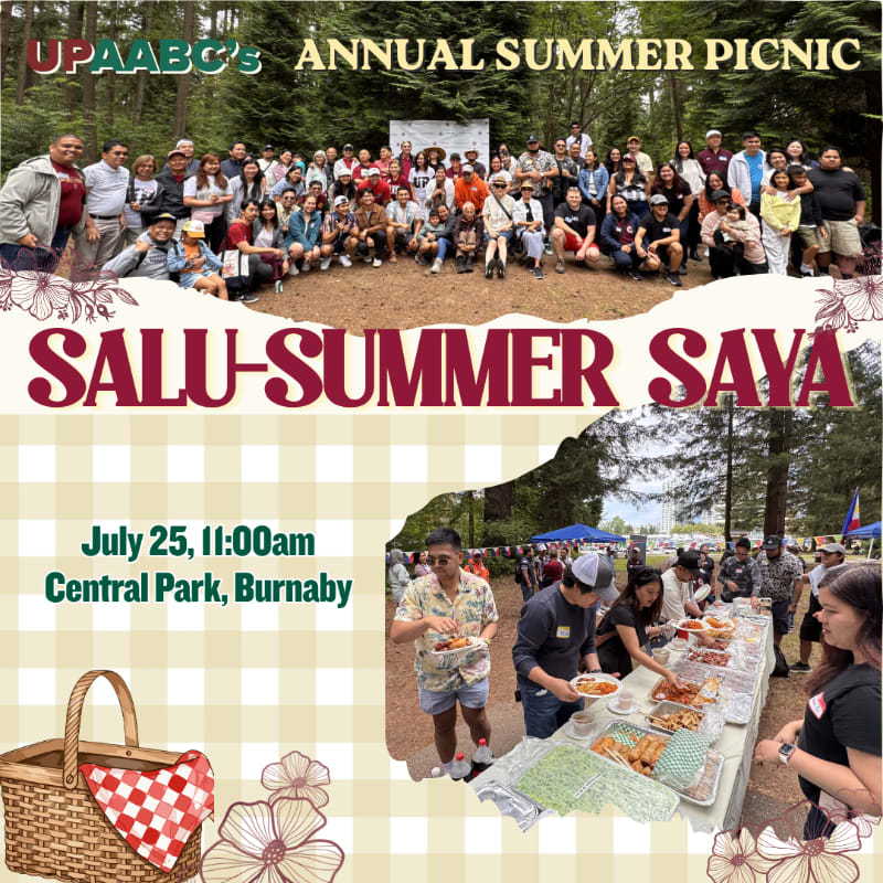 A large group of people are gathered for an annual summer picnic in a park, with a buffet spread in the foreground.