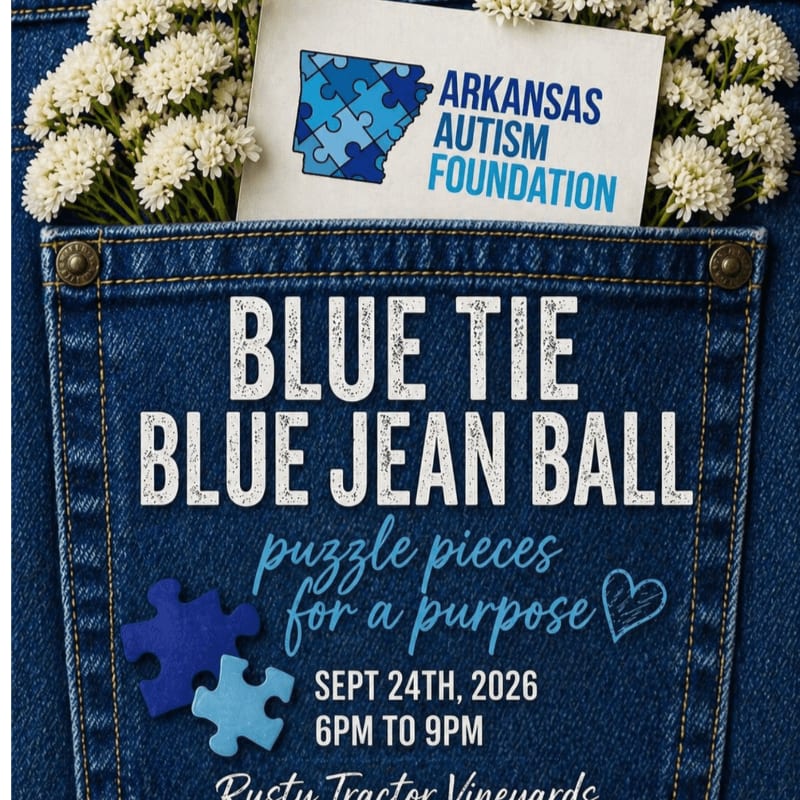 White flowers spill from the top pocket of blue jeans, which feature the text "BLUE TIE BLUE JEAN BALL" and event details, set against a blurred background of more denim.