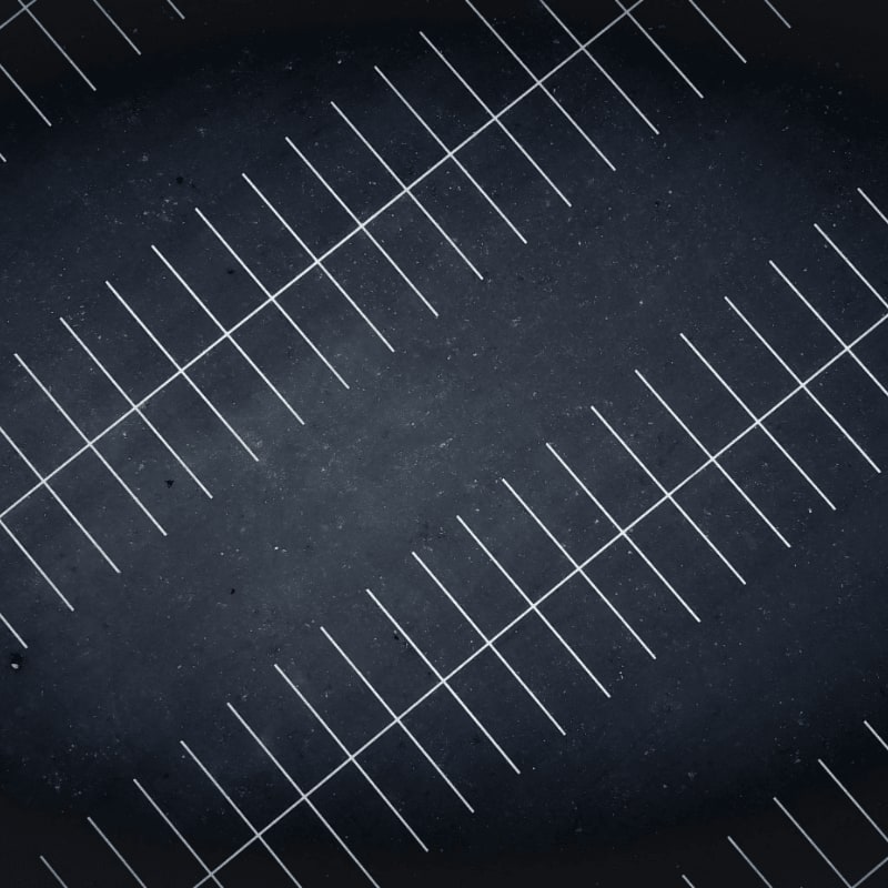A drone view at night of parking lot lines