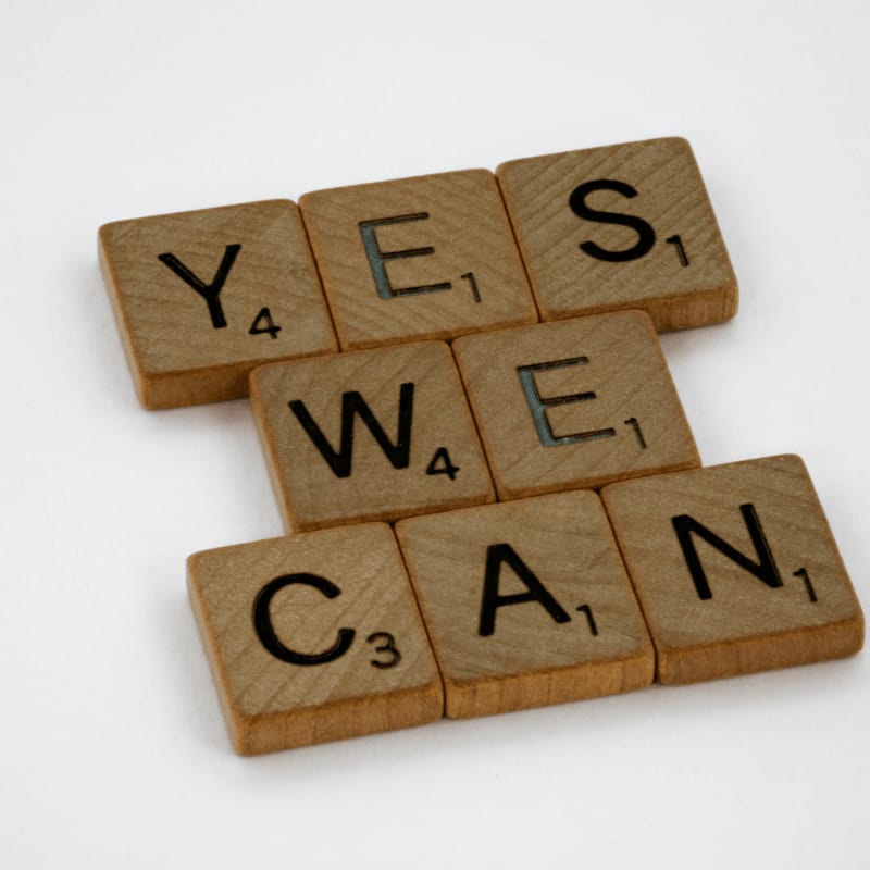 brown wooden letter blocks on white surface