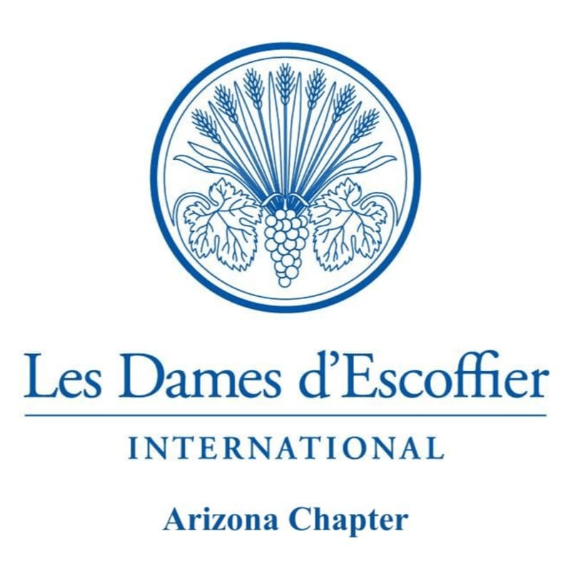 A blue circular emblem featuring wheat stalks and grapevines sits above text that reads "Les Dames d'Escoffier INTERNATIONAL Arizona Chapter" on a white background.