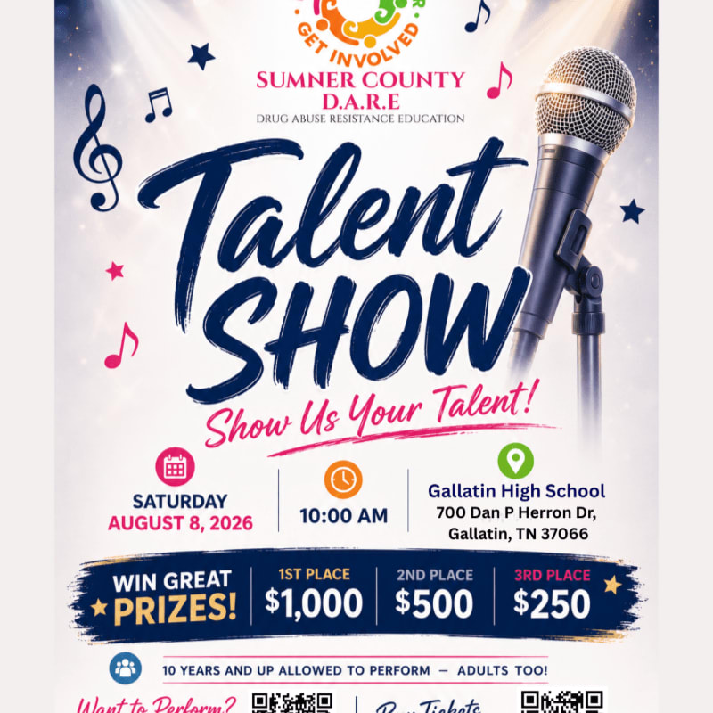 A microphone stands in the foreground against a background advertising a D.A.R.E. talent show with prize money and event details.
