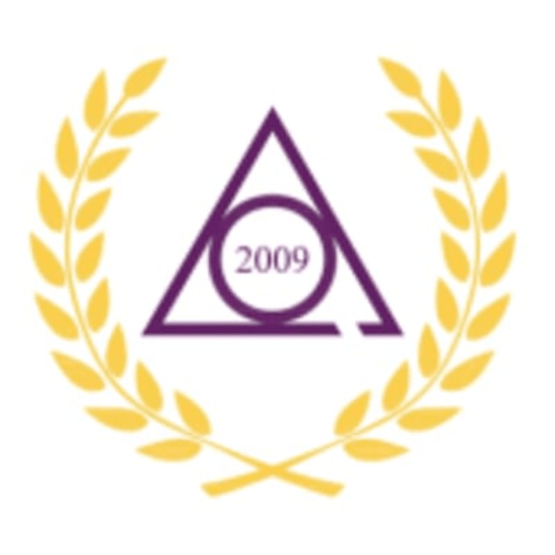 A purple triangle with a circle inside and the year 2009 is framed by a golden laurel wreath.