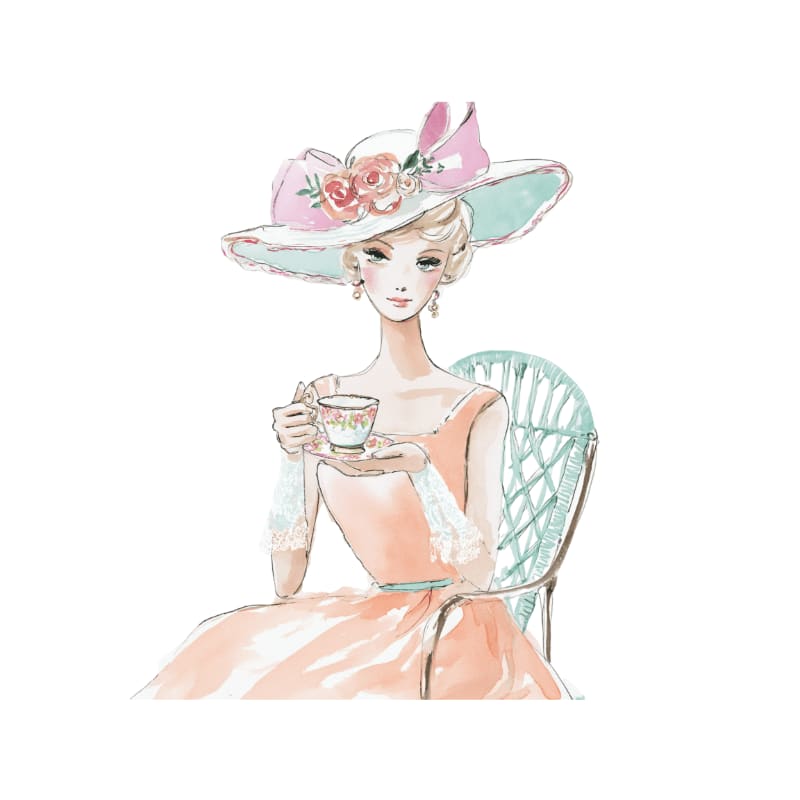 A woman in a wide-brimmed hat and peach dress sips tea while seated in a wicker chair against a white background.