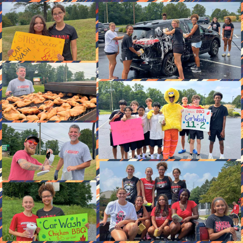 In the foreground, people hold signs and pose for photos, while the background features a car wash and a barbecue grill.