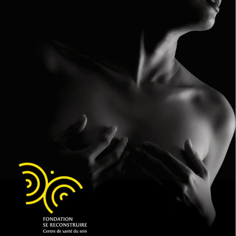 A woman's torso is illuminated against a dark background, with her hands gently cupping her breasts, while a yellow logo with text is in the lower left corner.