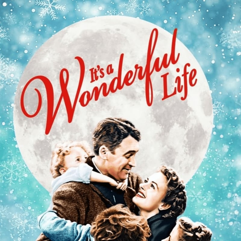 A smiling family is embraced in the foreground against a large, glowing moon and a backdrop of falling snowflakes.