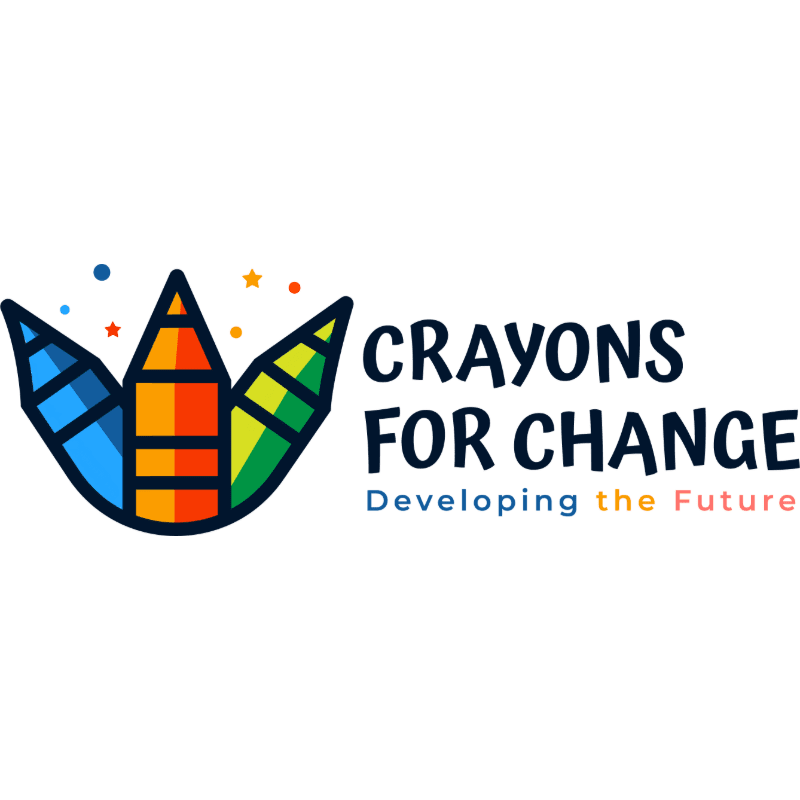 Three colorful crayons stand in the foreground, with the text "CRAYONS FOR CHANGE" and "Developing the Future" in the background.