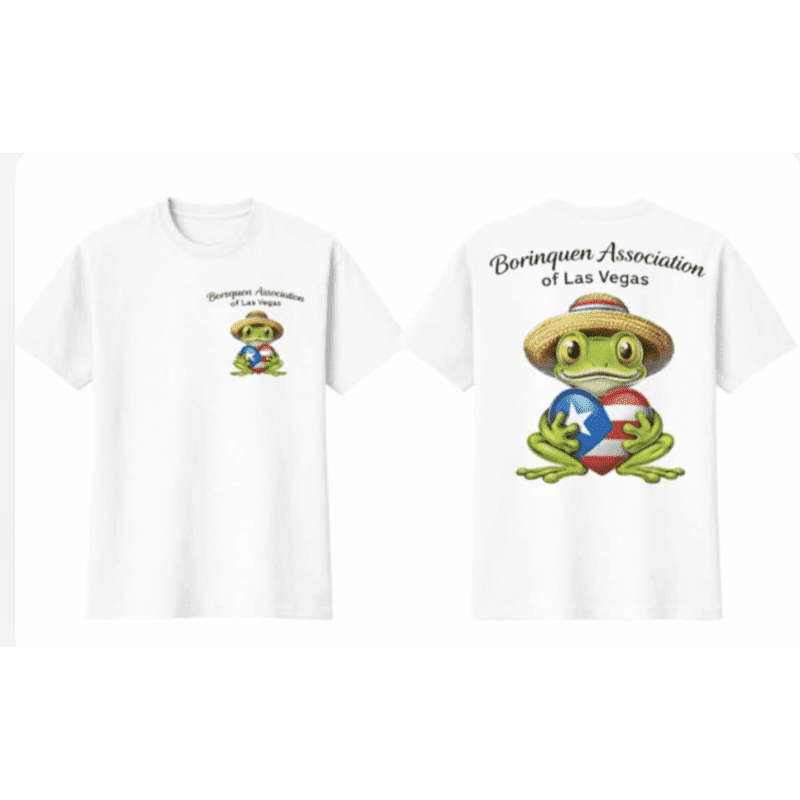 A white t-shirt displays a cartoon frog wearing a straw hat and holding a heart with the Puerto Rican flag on the front, while the back features a larger version of the same frog and the text "Borinquen Association of Las Vegas."