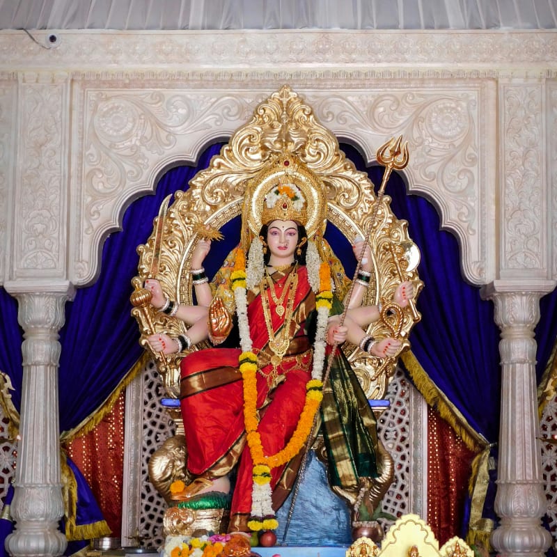 gold and red hindu deity statue