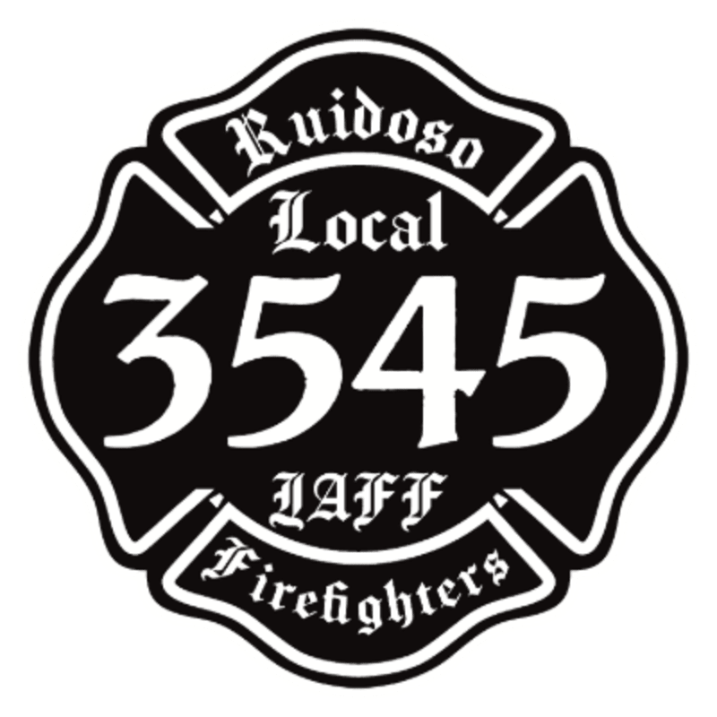 A black Maltese cross emblem with white lettering reading "Ruidoso Local 3545 IAFF Firefighters" is displayed against a white background.