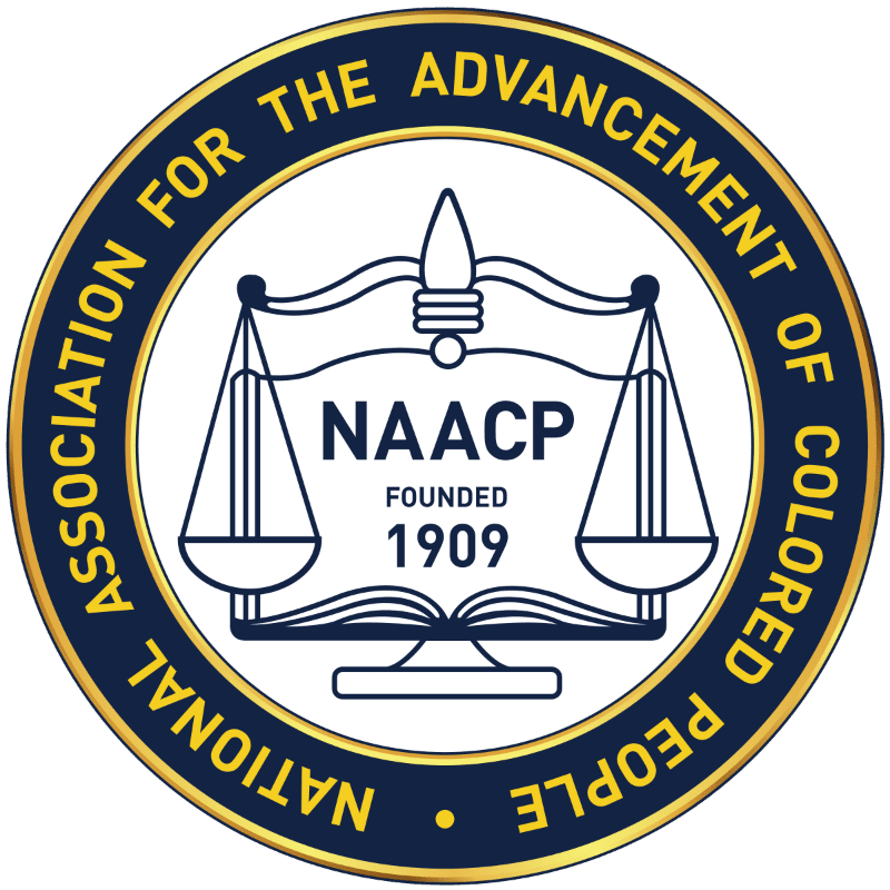 A circular emblem with a gold border features scales of justice and the NAACP logo in the foreground, set against a plain white background.
