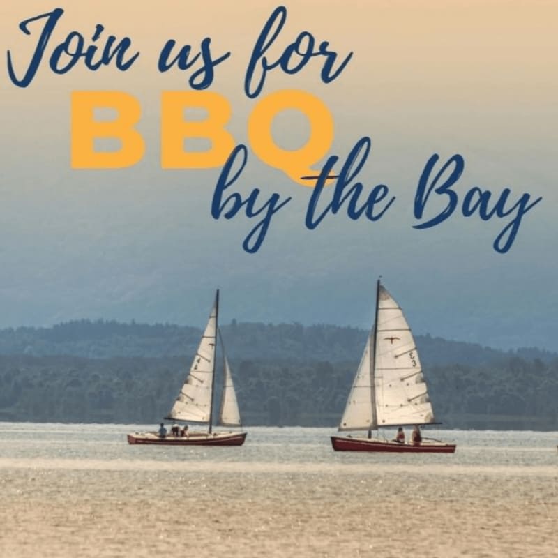 Two sailboats glide across a calm bay in the foreground, with text reading "Join us for BBQ by the Bay" overlaid on a hazy, tree-lined background.