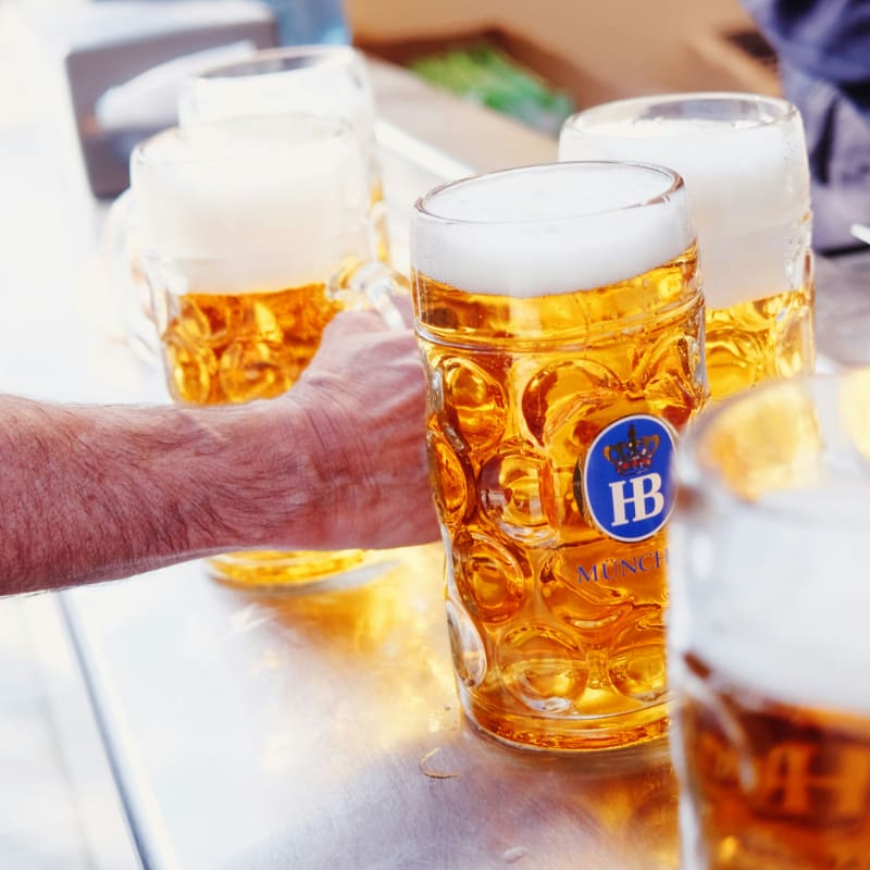 a table topped with lots of glasses of beer