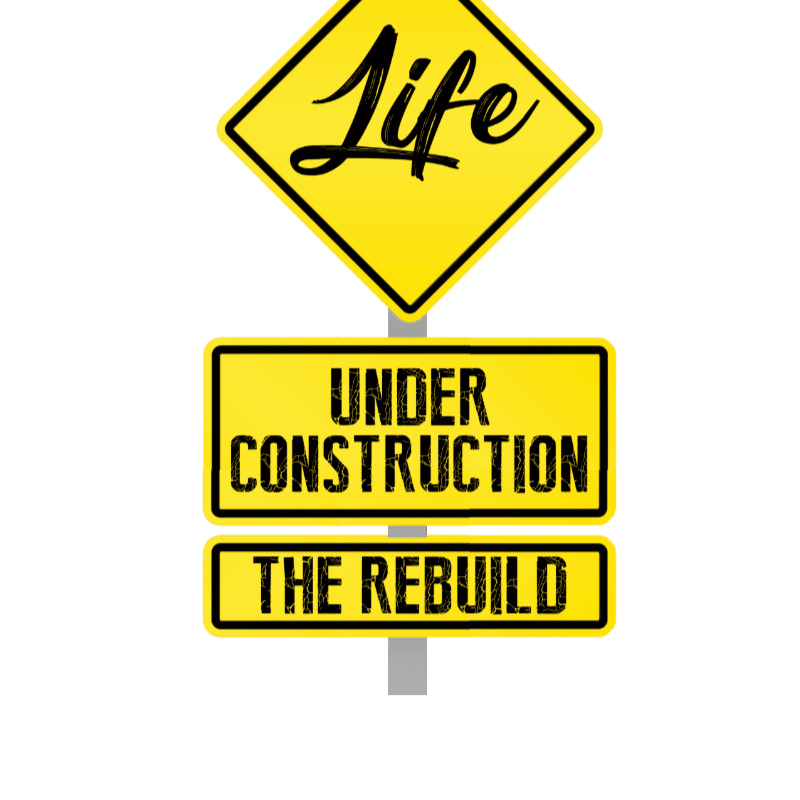 A yellow diamond-shaped sign with "Life" in cursive sits above two rectangular yellow signs, one reading "UNDER CONSTRUCTION" and the other "THE REBUILD," all on a white background.