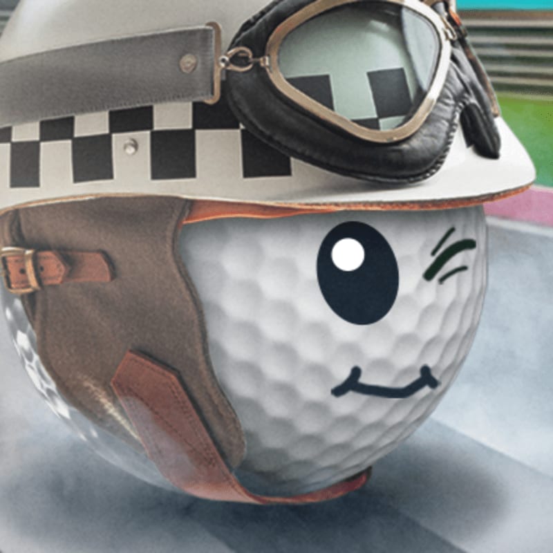 A golf ball with a vintage aviator helmet and goggles winks against a blurred, colorful background.