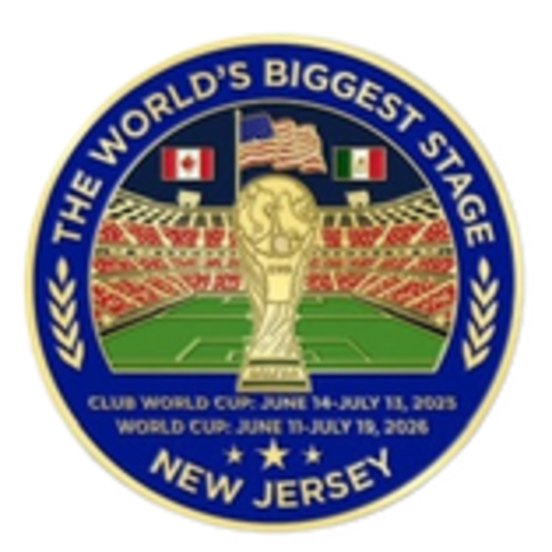 A golden trophy stands on a soccer field in front of a stadium filled with spectators, with flags of Canada, the USA, and Mexico flying above, all within a blue circular border that reads "THE WORLD'S BIGGEST STAGE" and "NEW JERSEY" with event dates.